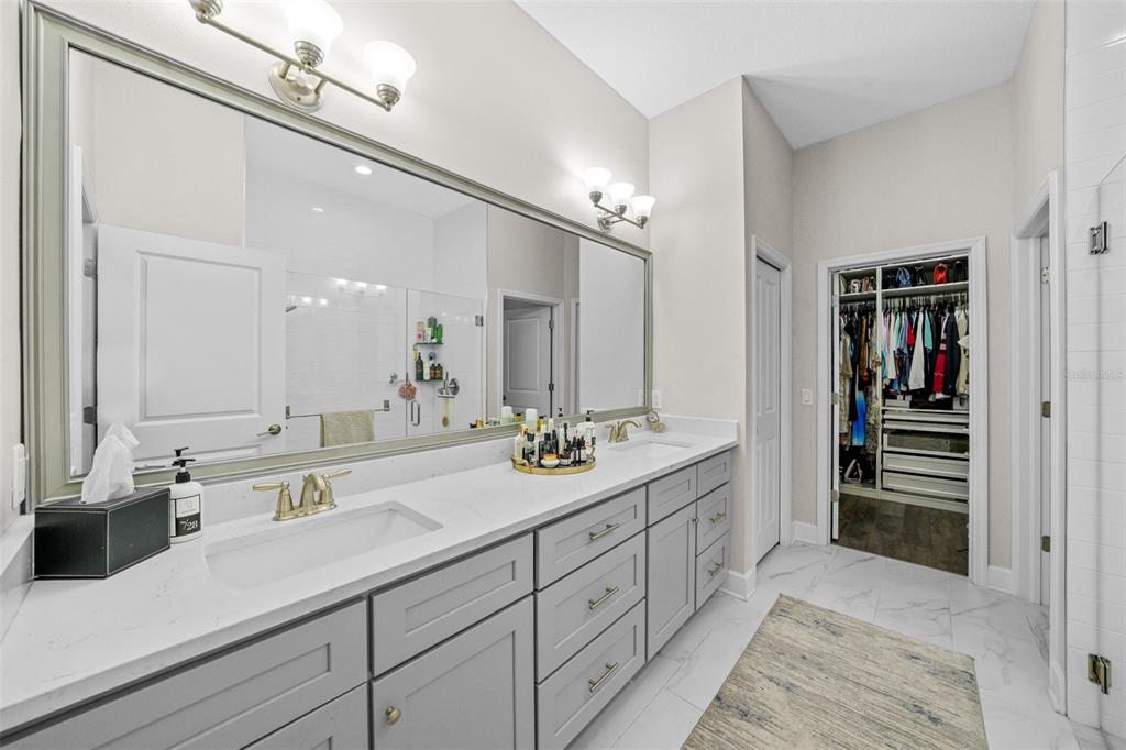 1404 Ridge Terrace Tarpon Springs, FL 34689 - Photo 14 of 38 a spacious bathroom with double sink and a mirror