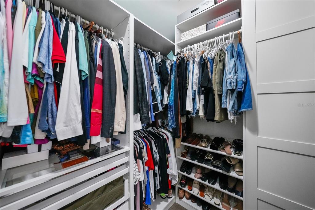 1404 Ridge Terrace Tarpon Springs, FL 34689 - Photo 16 of 38 a view of walk in closet with clothes