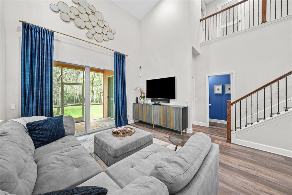 1404 Ridge Terrace Tarpon Springs, FL 34689 - Photo 2 of 38 a living room with furniture tv and a window