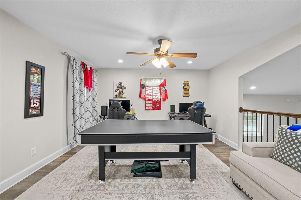 1404 Ridge Terrace Tarpon Springs, FL 34689 - Photo 23 of 38 a room with furniture and window