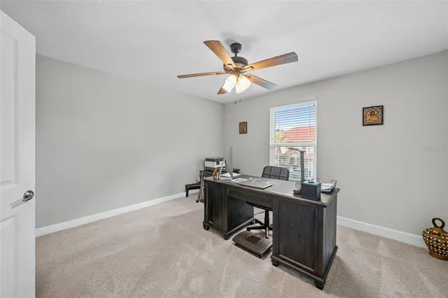 a view of a workspace with furniture