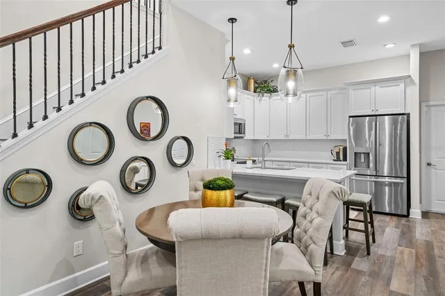 a kitchen with a table and chairs in it