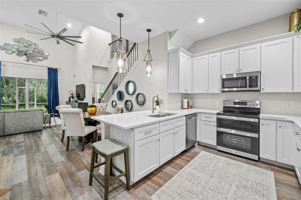 1404 Ridge Terrace Tarpon Springs, FL 34689 - Photo 9 of 38 a kitchen that has a lot of cabinets in it and appliances