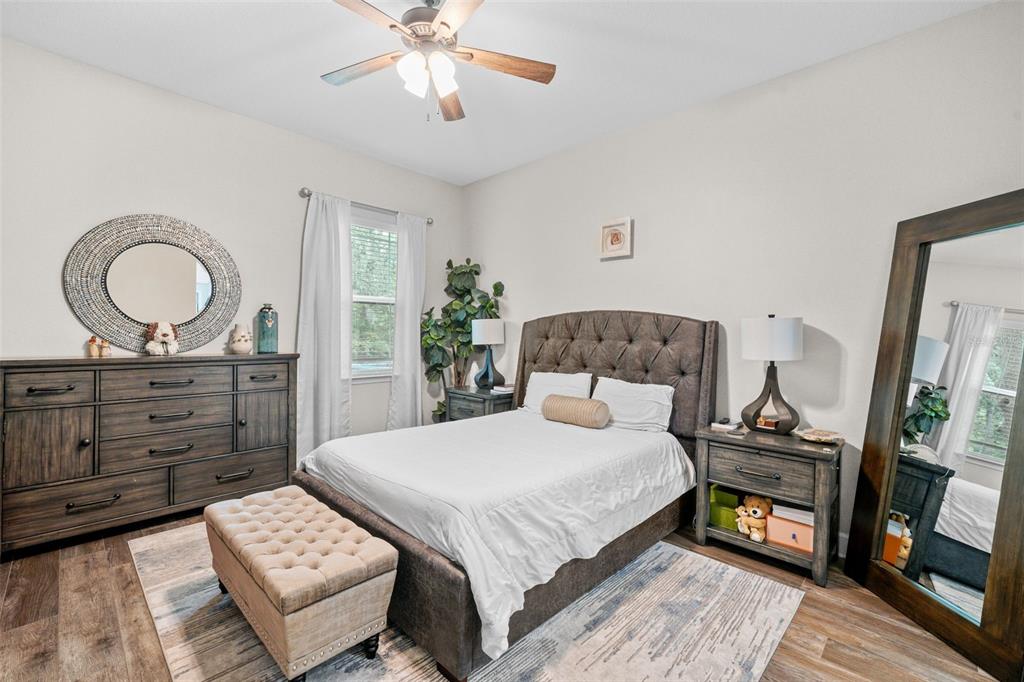 1404 Ridge Terrace Tarpon Springs, FL 34689 - Photo 10 of 38 a bedroom with a bed and a mirror on the dresser