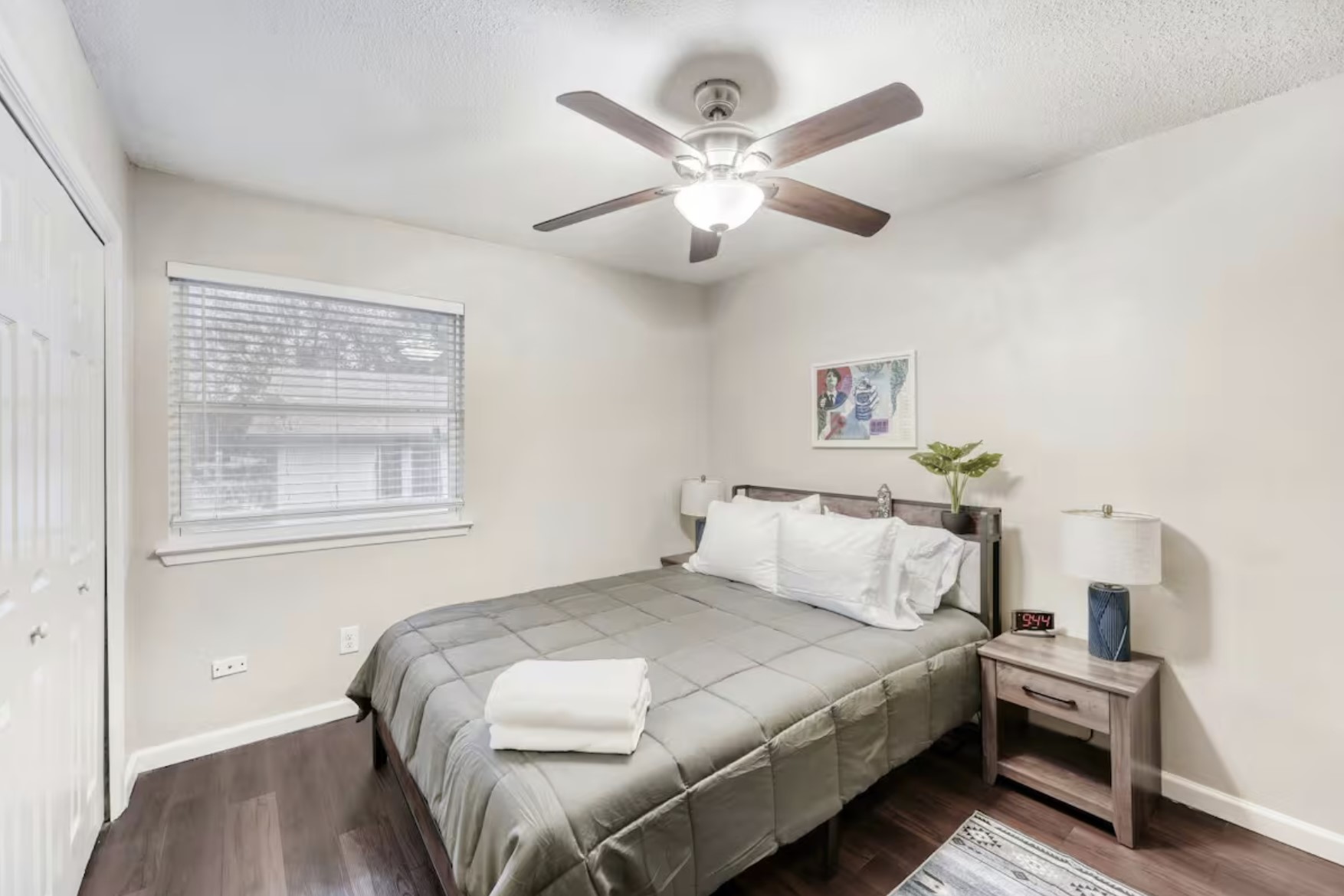 4903 Merritt Drive Austin, TX 78744 - Photo 4 of 6 a bedroom with a bed and a chandelier