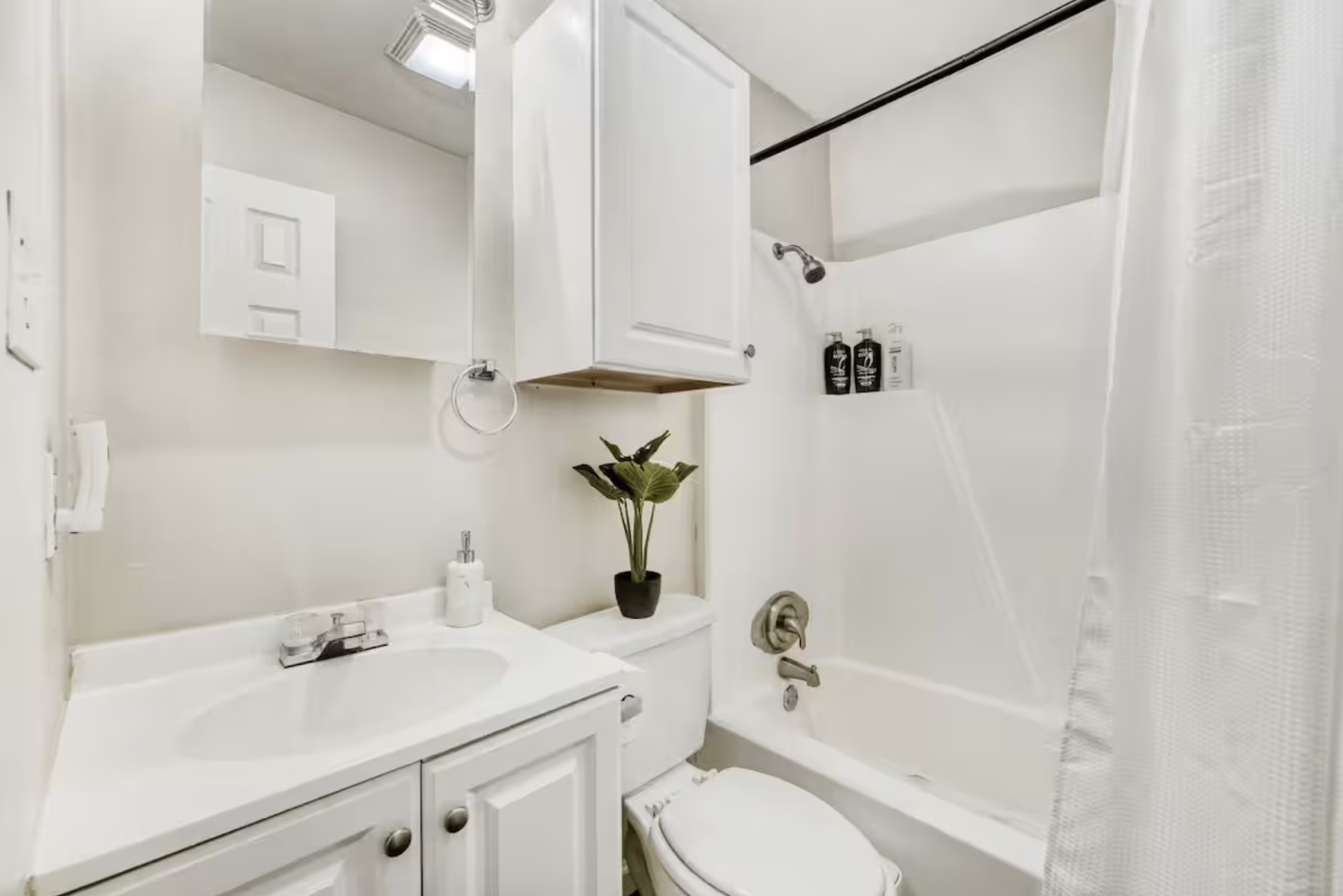 4903 Merritt Drive Austin, TX 78744 - Photo 5 of 6 a bathroom with a sink a toilet and shower
