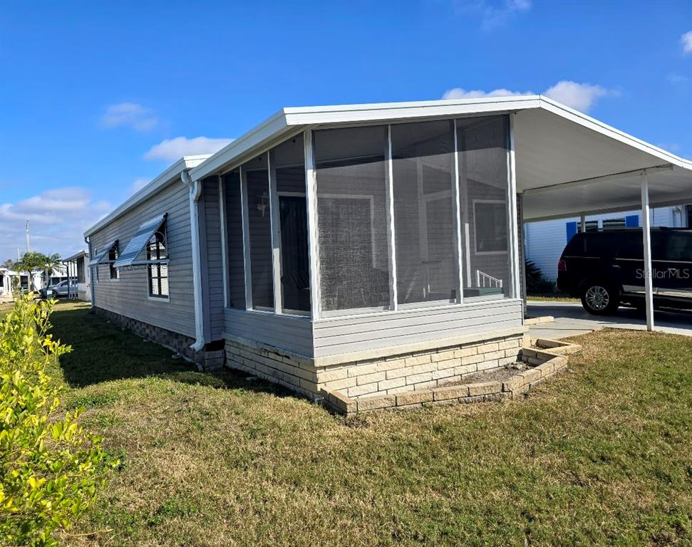 12501 Ulmerton Road, Unit 188 Largo, FL 33774 - Photo 55 of 63 a view of a house with a yard