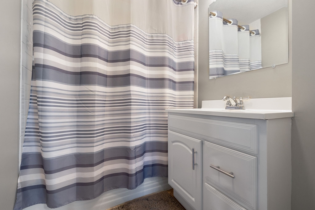 314 Water Street, Unit 5 Wakefield, MA 01880 - Photo 11 of 20 a bathroom with a sink and a mirror