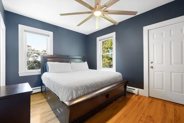a bedroom with a bed and window