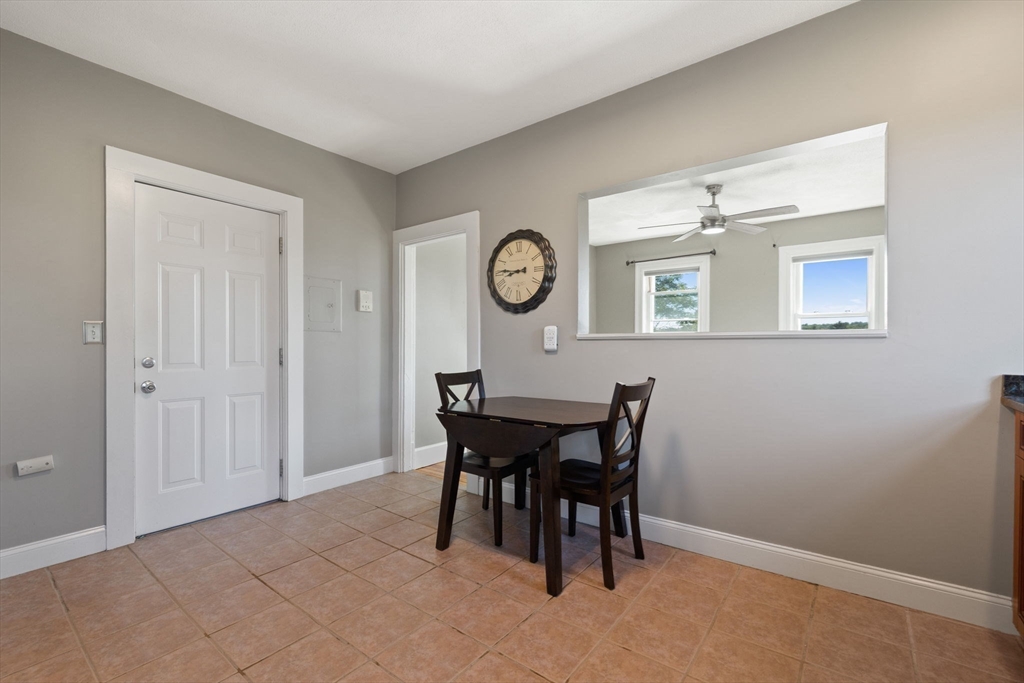 314 Water Street, Unit 5 Wakefield, MA 01880 - Photo 9 of 20 a view of a dining room with furniture and window