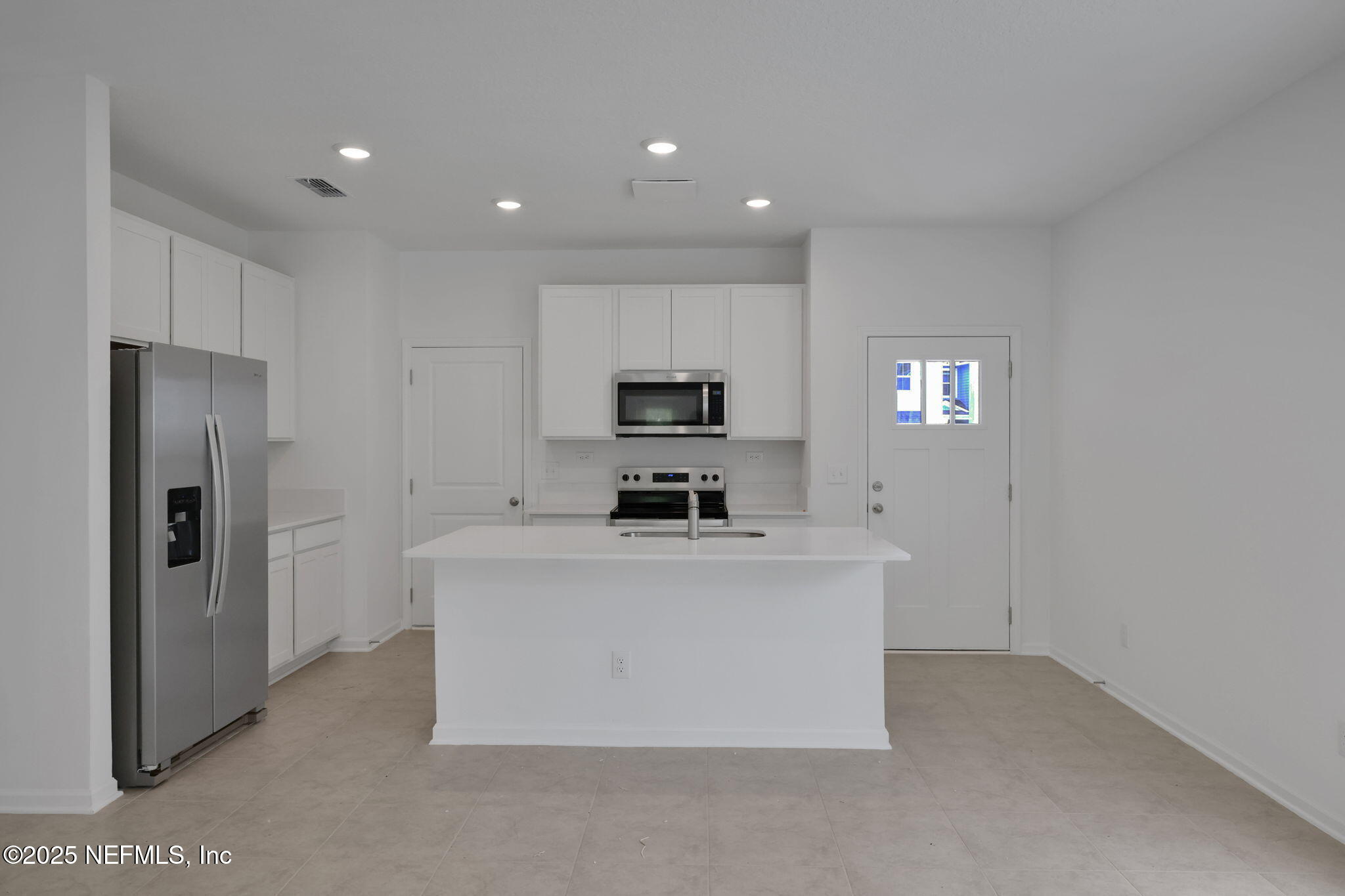 3786 Athenian Way Middleburg, FL 32068 - Photo 6 of 25 a view of kitchen with kitchen island stainless steel appliances a refrigerator and a stove top oven