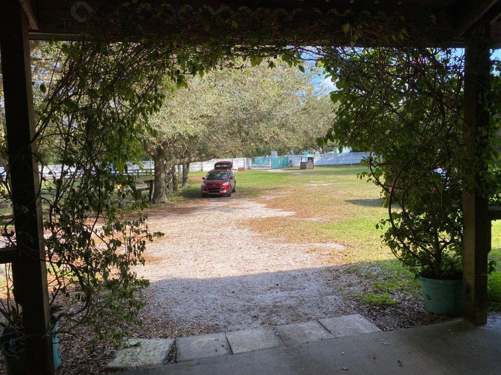 2141 B Road, Unit 4 Loxahatchee Groves, FL 33470 - Photo 18 of 43 a view of a yard with an outdoor space