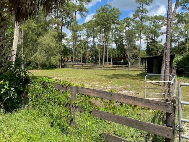 2141 B Road, Unit 4 Loxahatchee Groves, FL 33470 - Photo 34 of 43 a view of a yard with an trees