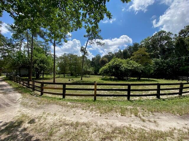 2141 B Road, Unit 4 Loxahatchee Groves, FL 33470 - Photo 38 of 43 a view of park benches sitting below a tree