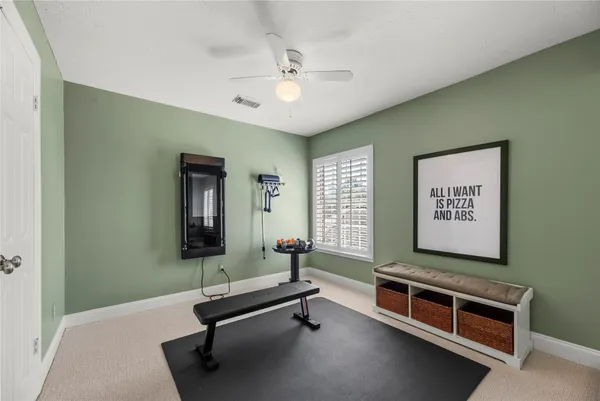 a bed room with a bed and a television