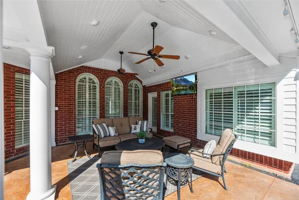 a outdoor living space with furniture and a fireplace