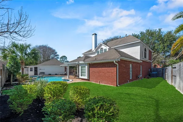 a view of a house with a swimming pool
