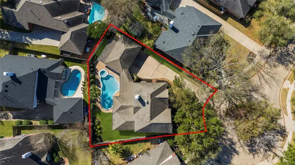 an aerial view of houses with outdoor space
