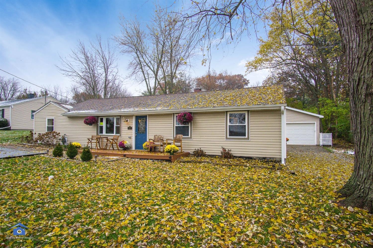a front view of house with yard and seating area