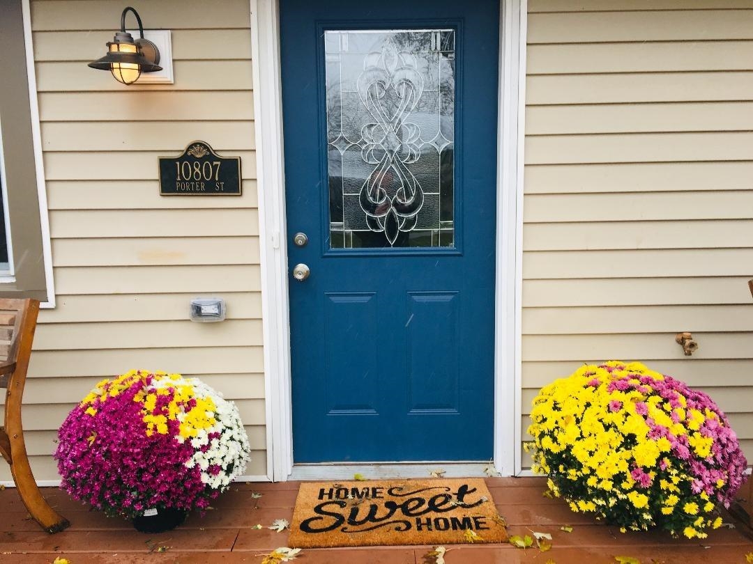 10807 Porter Street Crown Point, IN 46307 - Photo 2 of 10 a view of a entryway door of the house and living room
