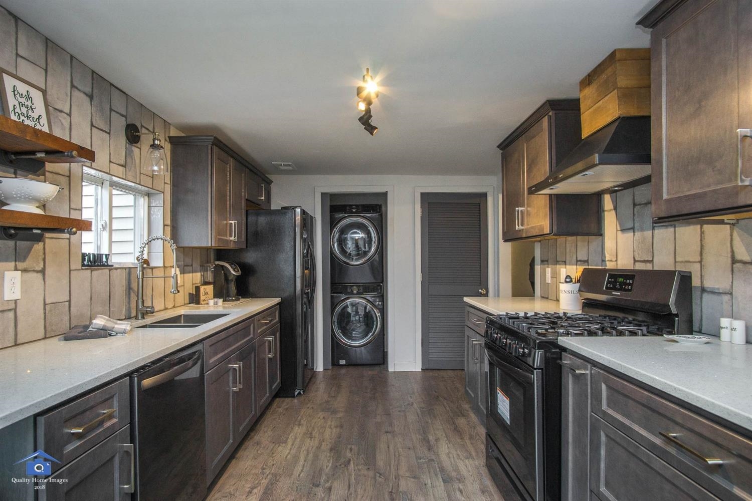 10807 Porter Street Crown Point, IN 46307 - Photo 10 of 10 a kitchen with stainless steel appliances granite countertop a stove a sink dishwasher and a refrigerator