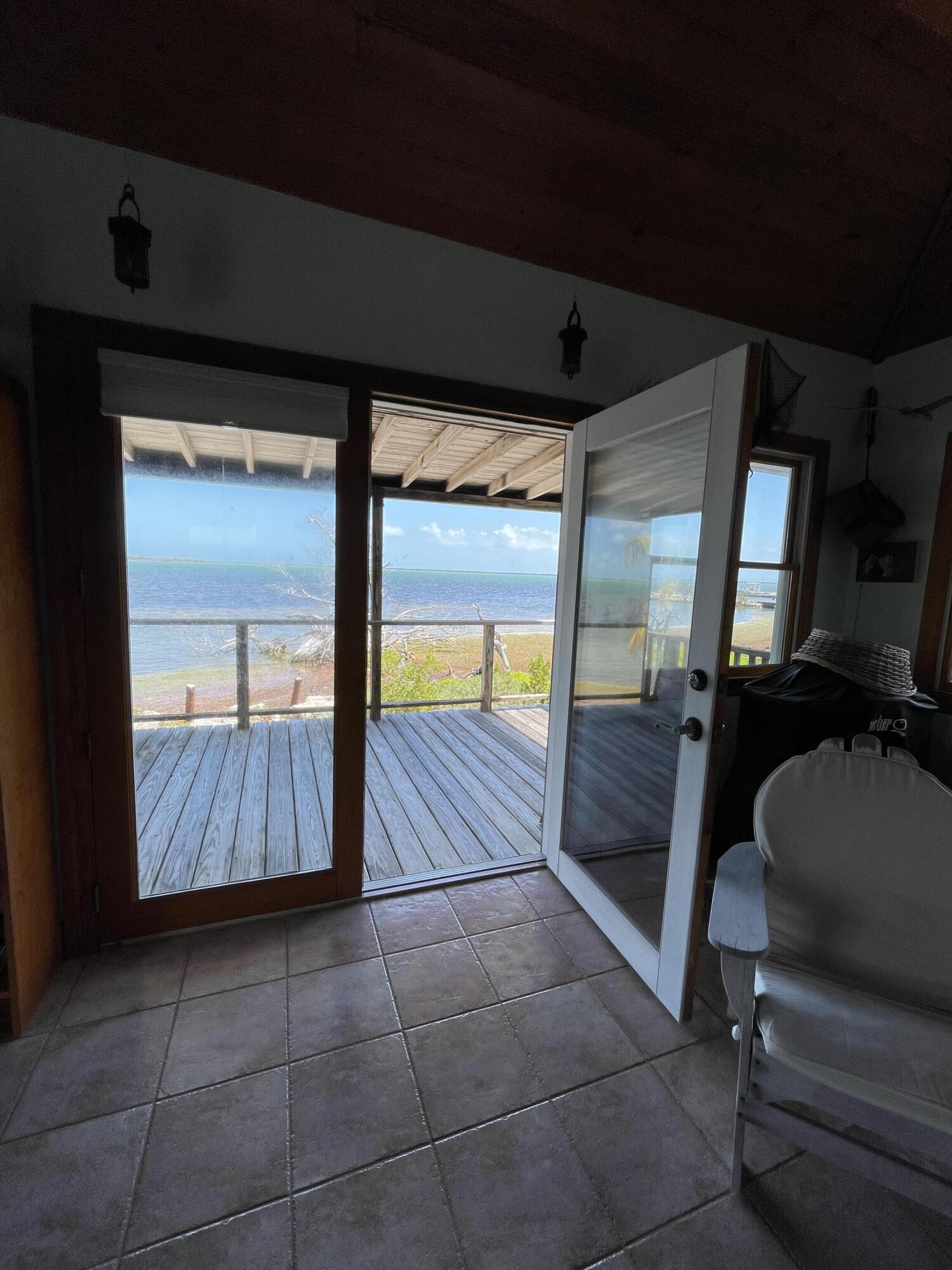31625 Warner Street Big Pine Key, FL 33043 - Photo 23 of 30 a bathroom with a tub and a shower