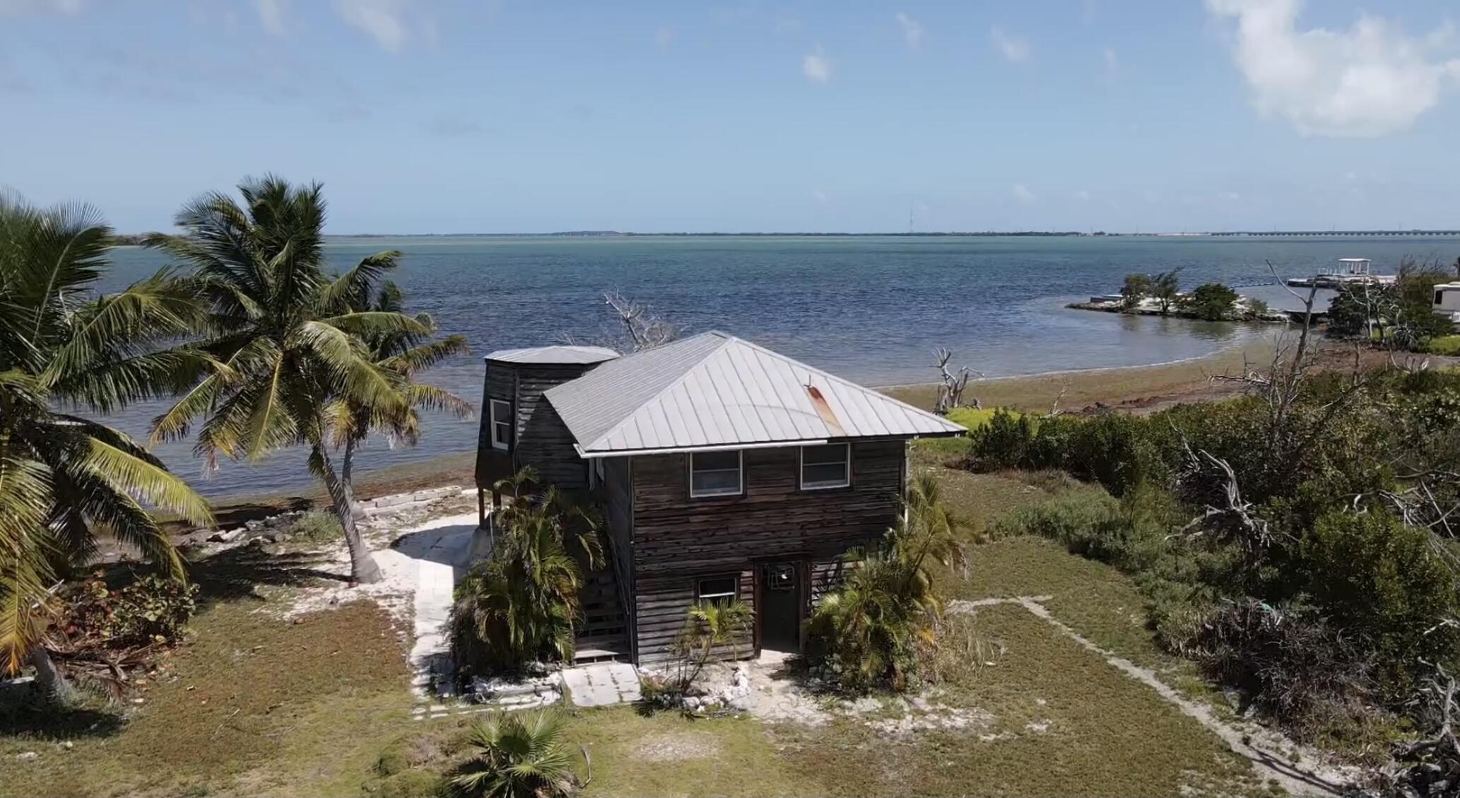 31625 Warner Street Big Pine Key, FL 33043 - Photo 5 of 30 a view of a house with swimming pool and sitting area