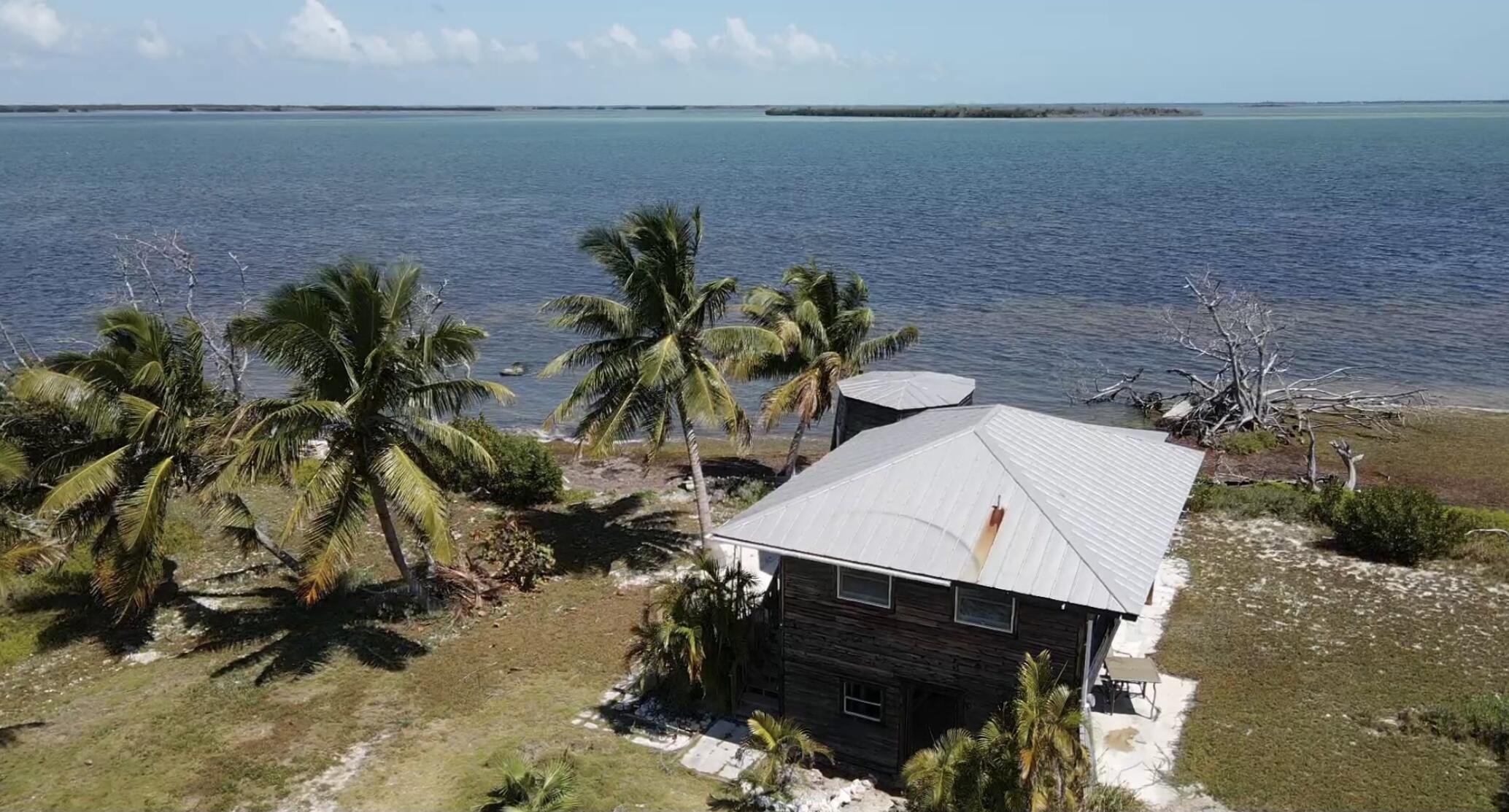 31625 Warner Street Big Pine Key, FL 33043 - Photo 6 of 30 a picture of a lake with a building in the background