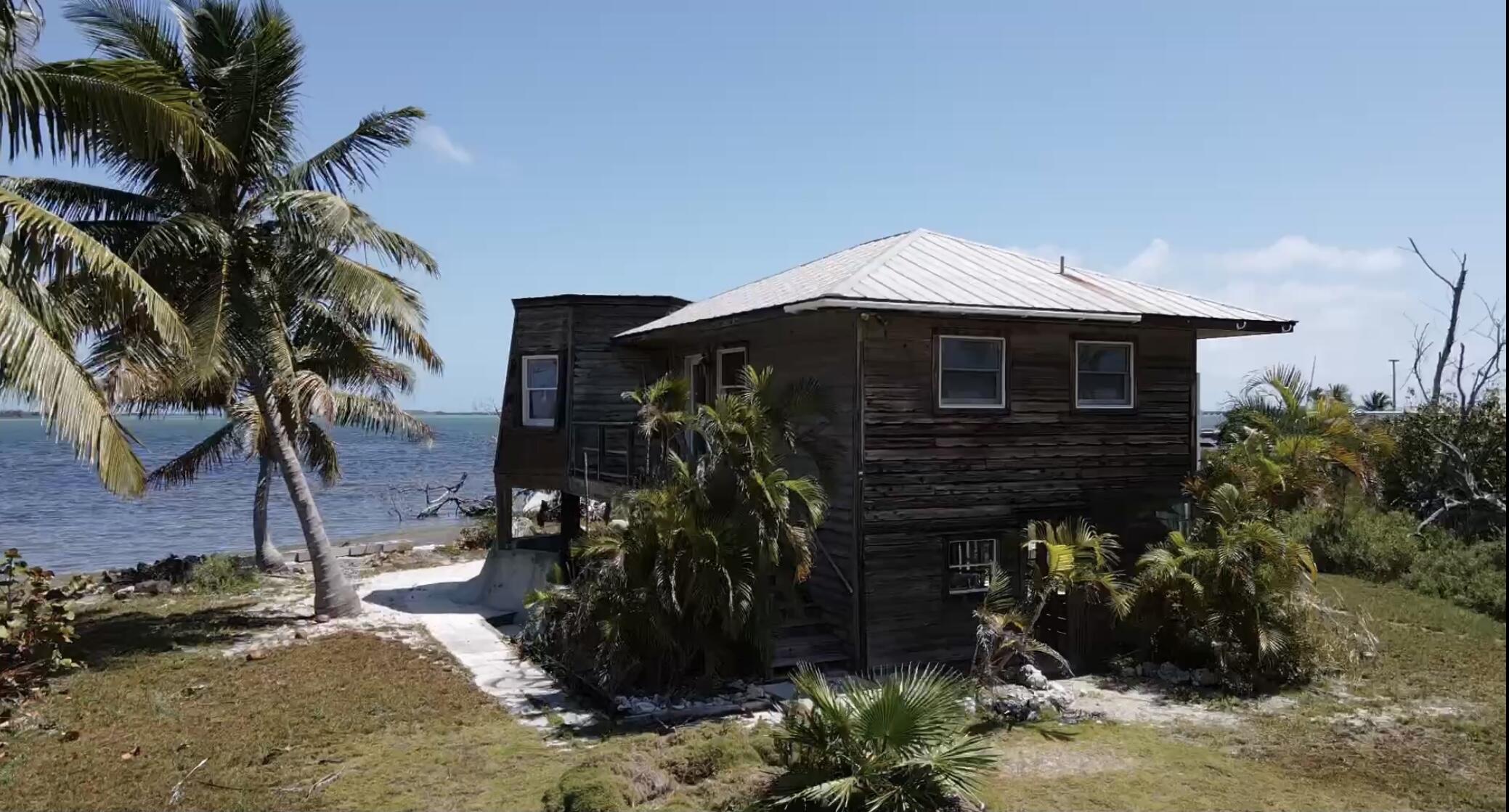 31625 Warner Street Big Pine Key, FL 33043 - Photo 10 of 30 a front view of a house with a yard