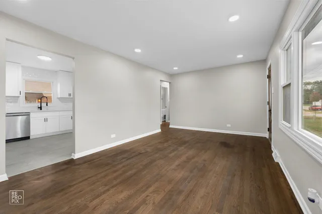 a view of a kitchen cabinets and a wooden floor
