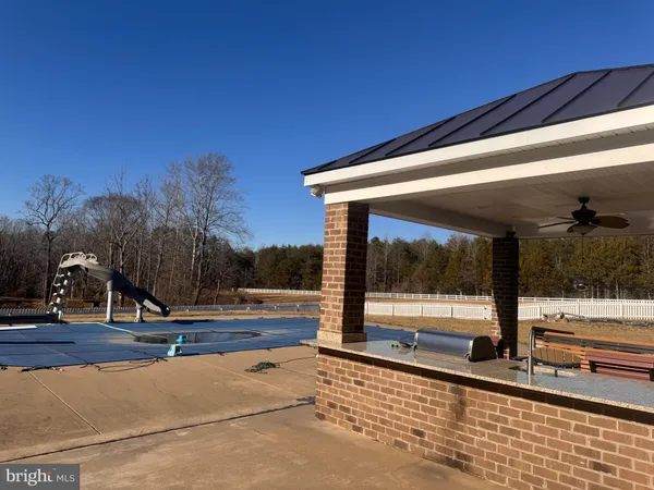 a view of a swimming pool with yard
