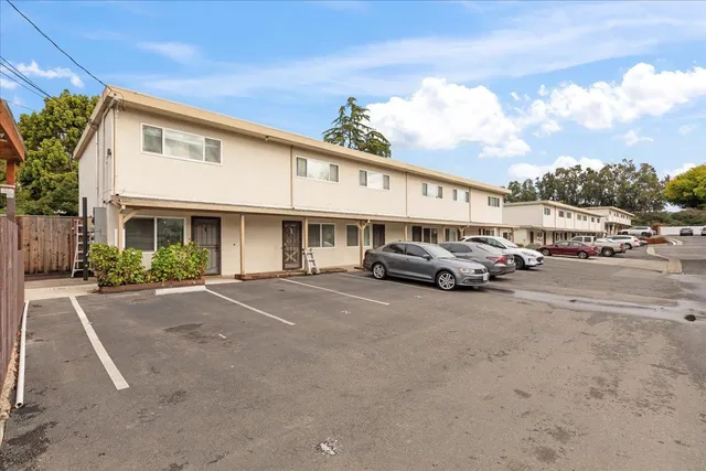 a view of a car parked in front of a building