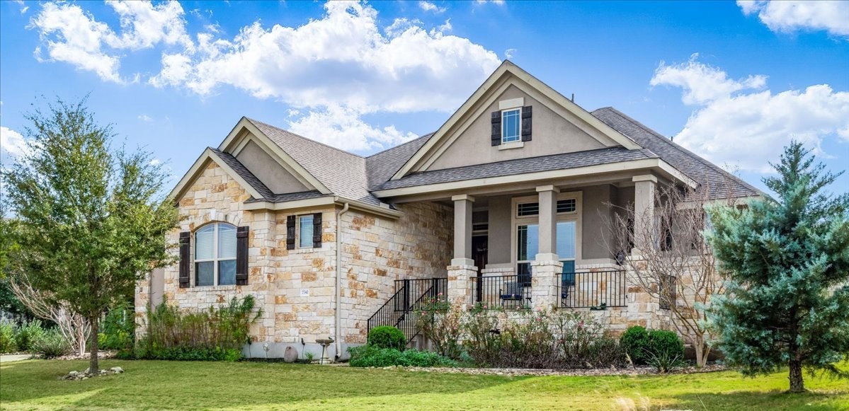 a front view of a house with a yard