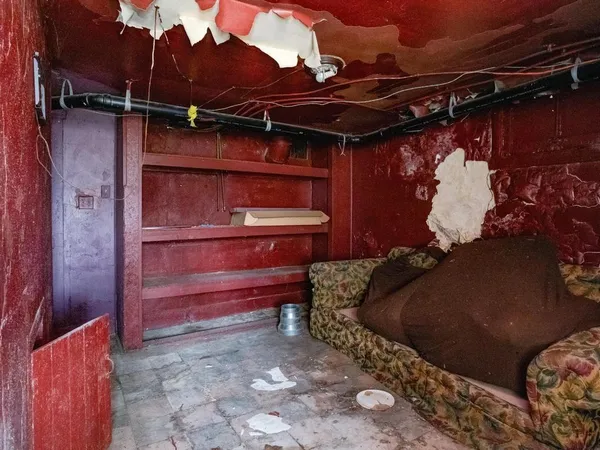 a bed room with a bed and a chair