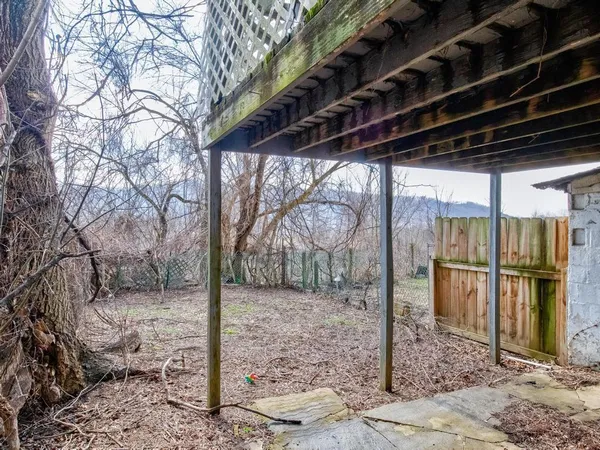 a backyard of a house with stainless steel appliances