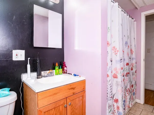 a kitchen with a sink a stove and a dining table