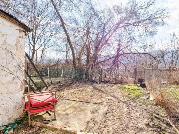 a backyard of a house with seating space