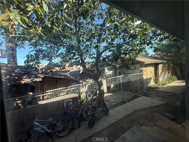 a view of a house with a tree