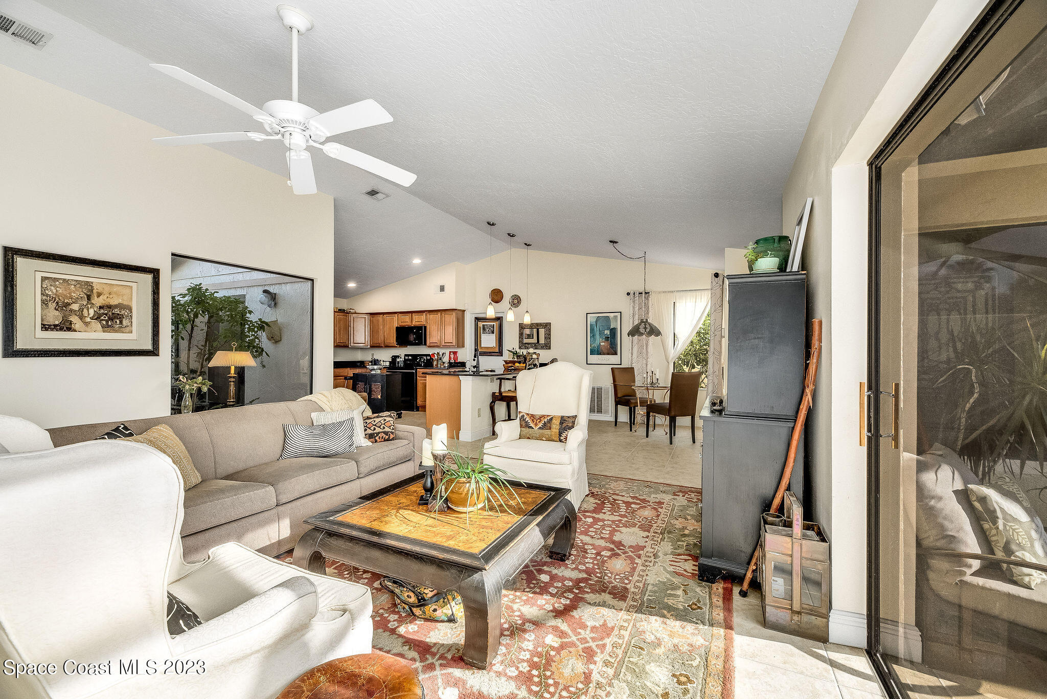 440 Maple Bluff Circle Melbourne, FL 32940 - Photo 20 of 92 a living room with furniture and a flat screen tv