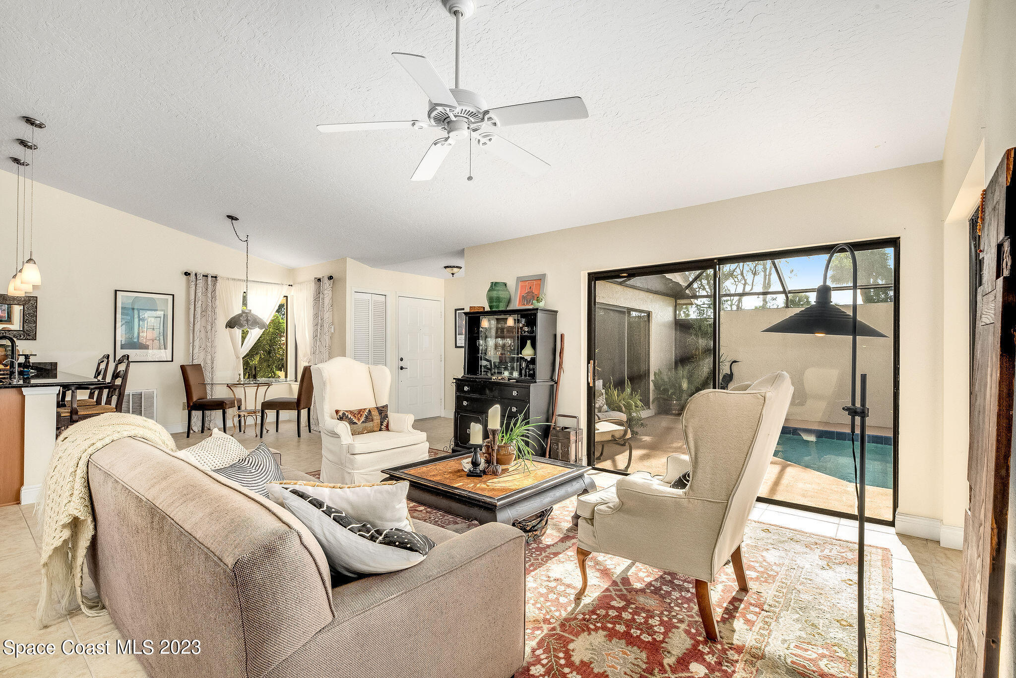 440 Maple Bluff Circle Melbourne, FL 32940 - Photo 21 of 92 a living room with furniture and a large window