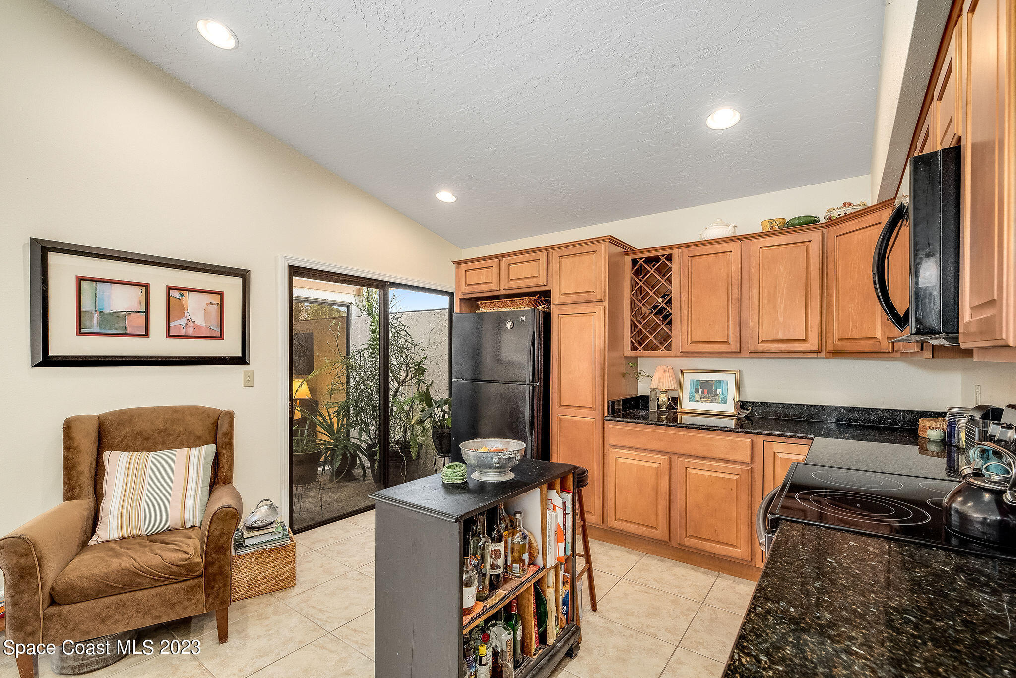 440 Maple Bluff Circle Melbourne, FL 32940 - Photo 23 of 92 a open kitchen with stainless steel appliances granite countertop a stove a sink and a refrigerator