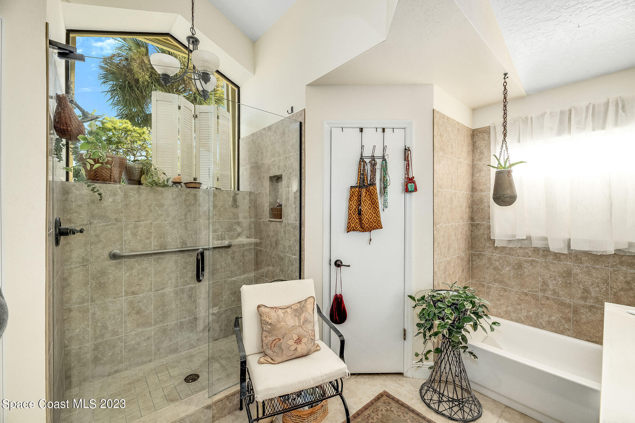 440 Maple Bluff Circle Melbourne, FL 32940 - Photo 34 of 92 a bathroom with a shower and a bath tub