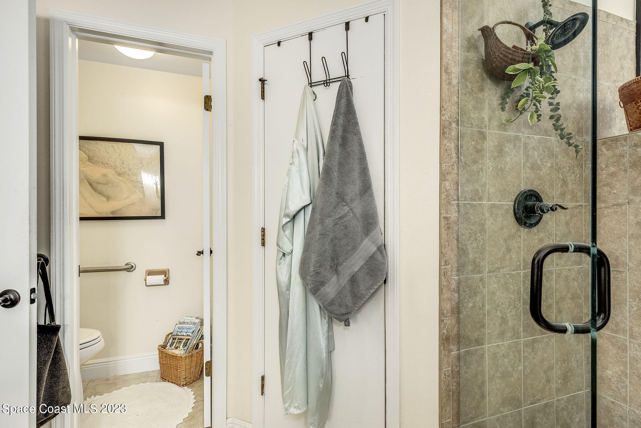 440 Maple Bluff Circle Melbourne, FL 32940 - Photo 35 of 92 a bathroom with a shower toilet and sink