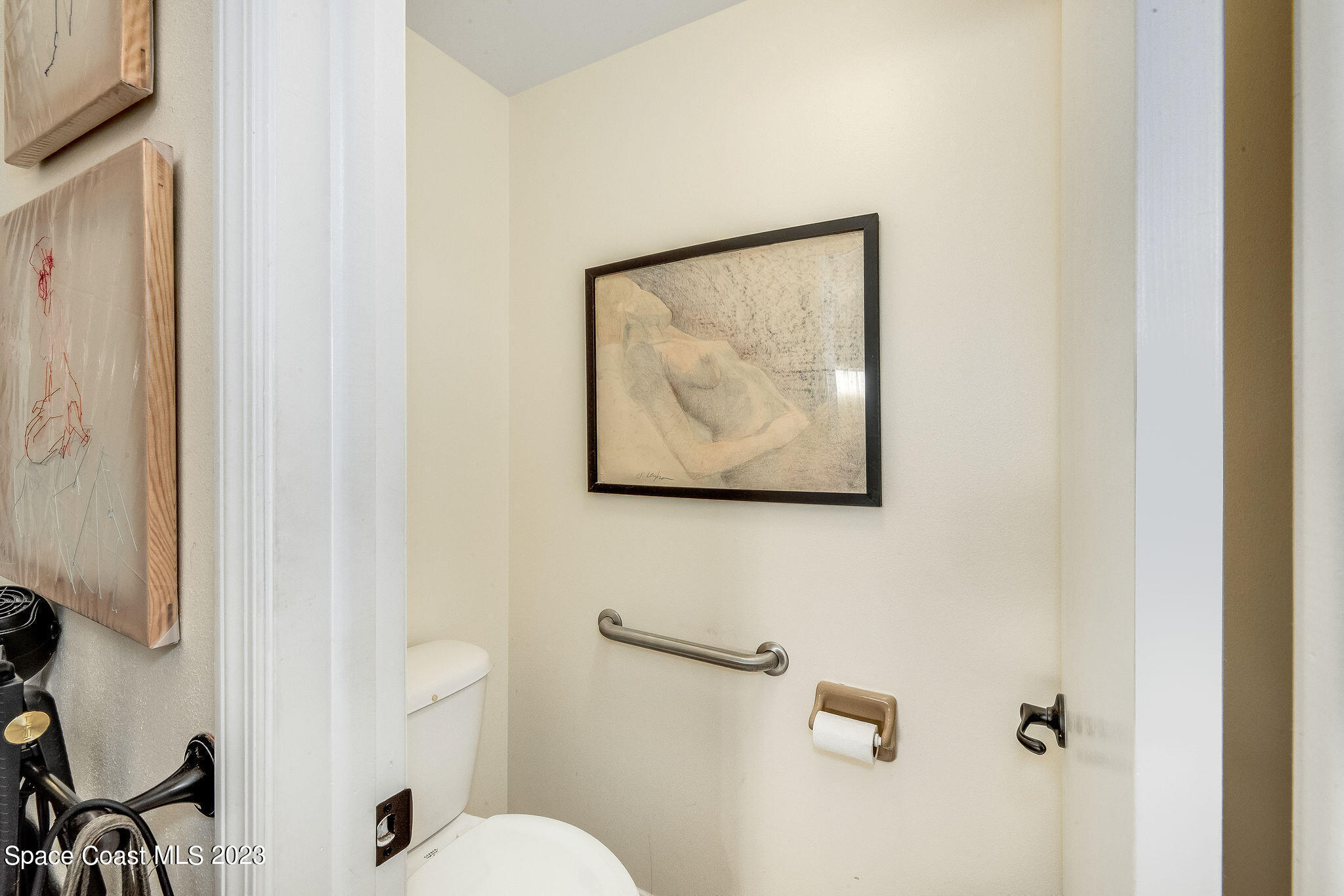 440 Maple Bluff Circle Melbourne, FL 32940 - Photo 36 of 92 a bathroom with a painting on the wall and a shower