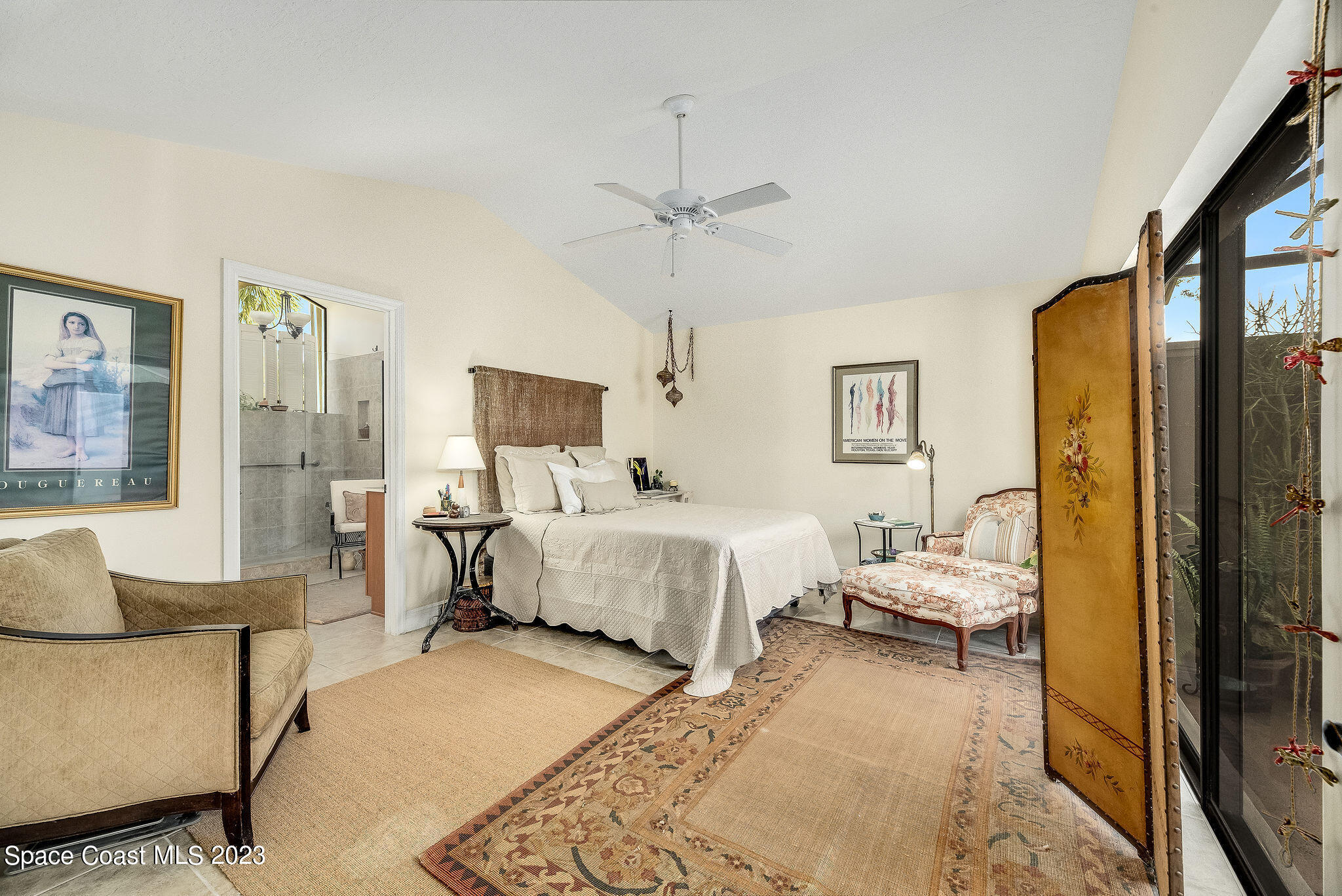 440 Maple Bluff Circle Melbourne, FL 32940 - Photo 37 of 92 a spacious bedroom with a bed and a couch