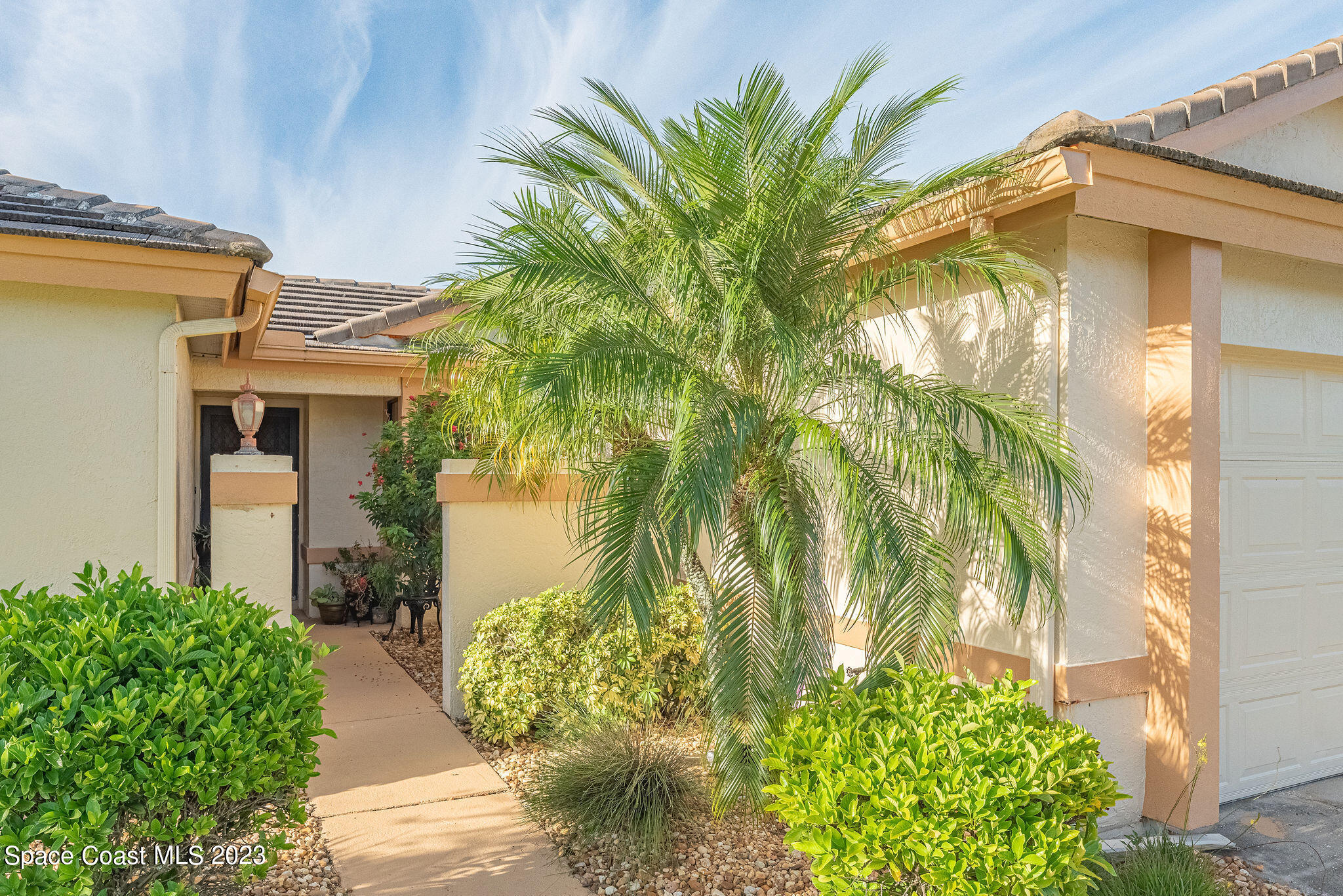 440 Maple Bluff Circle Melbourne, FL 32940 - Photo 6 of 92 a front view of a house with a yard