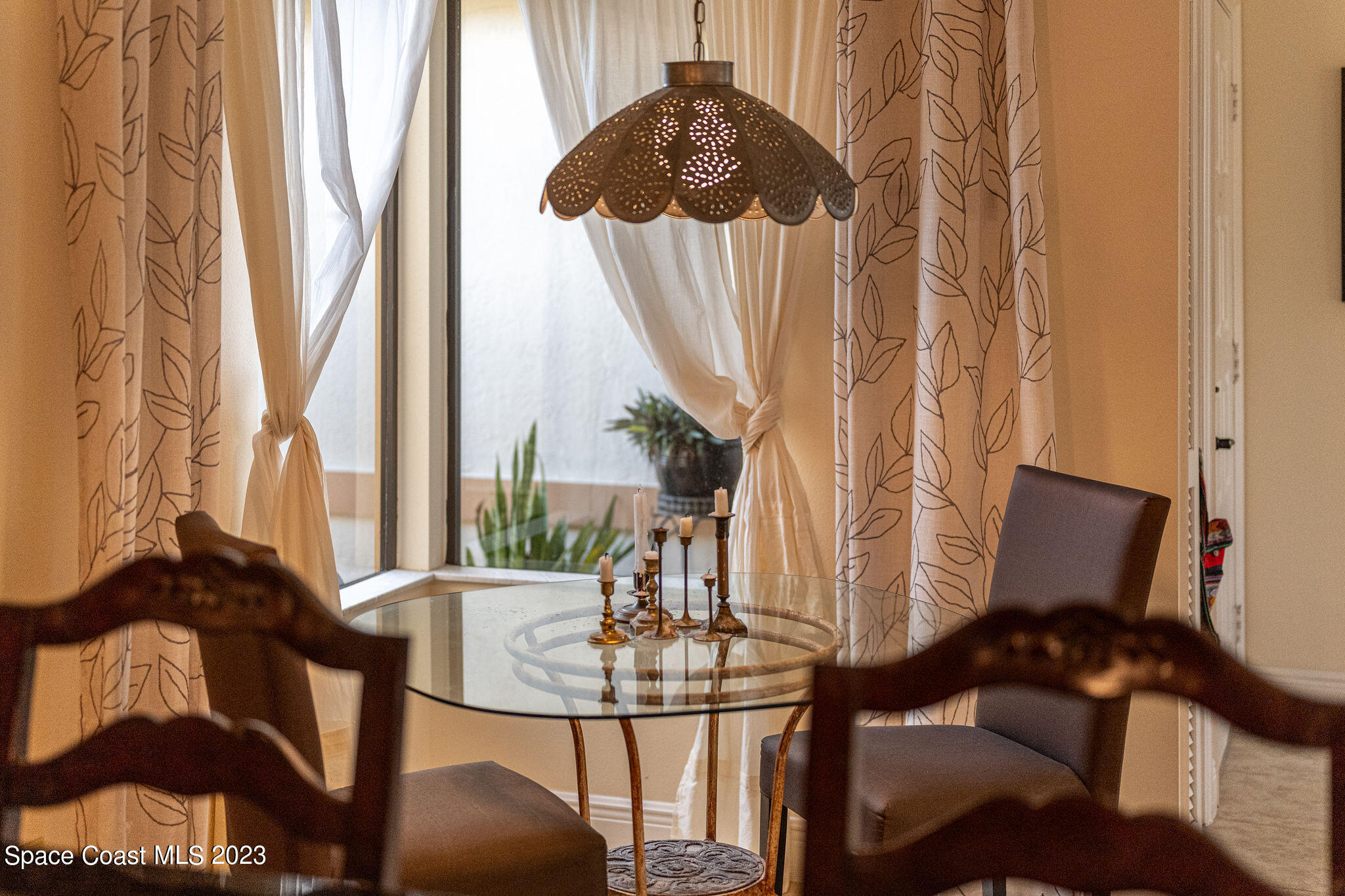 440 Maple Bluff Circle Melbourne, FL 32940 - Photo 61 of 92 a view of a balcony with chairs