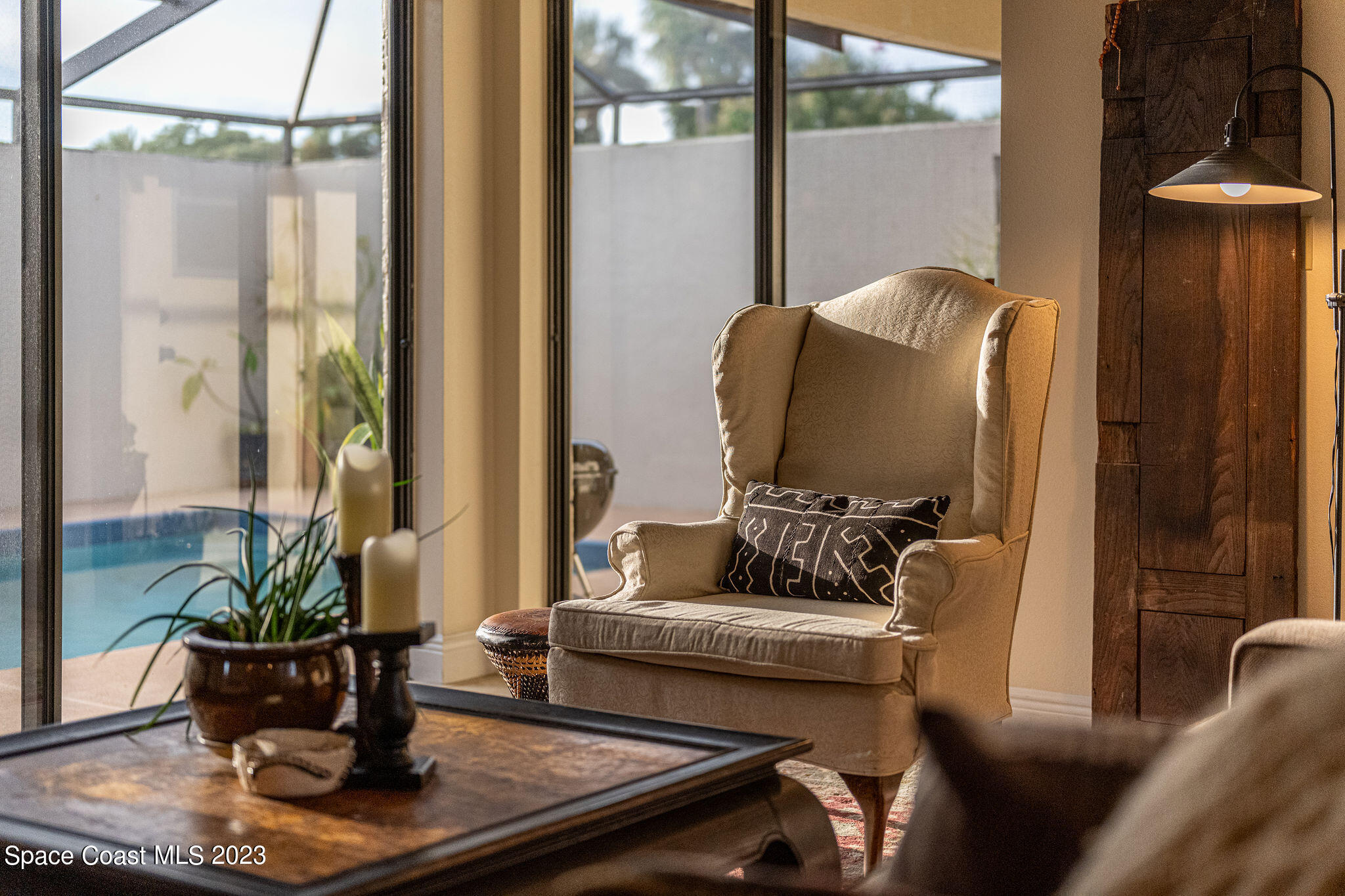 440 Maple Bluff Circle Melbourne, FL 32940 - Photo 64 of 92 a living room with furniture and a potted plant