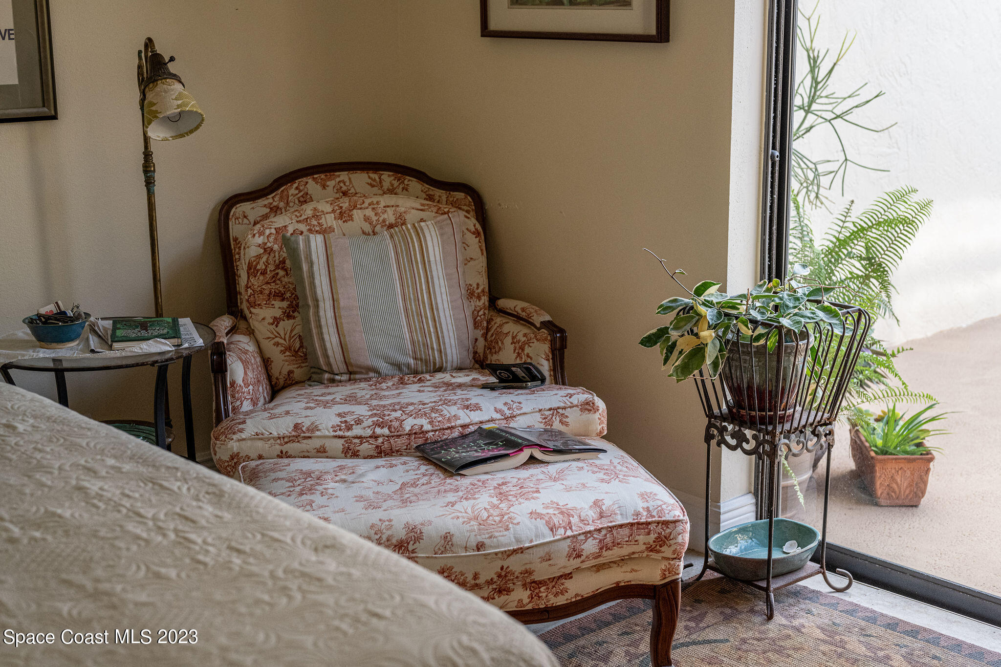 440 Maple Bluff Circle Melbourne, FL 32940 - Photo 69 of 92 a bedroom with bed and a potted plant