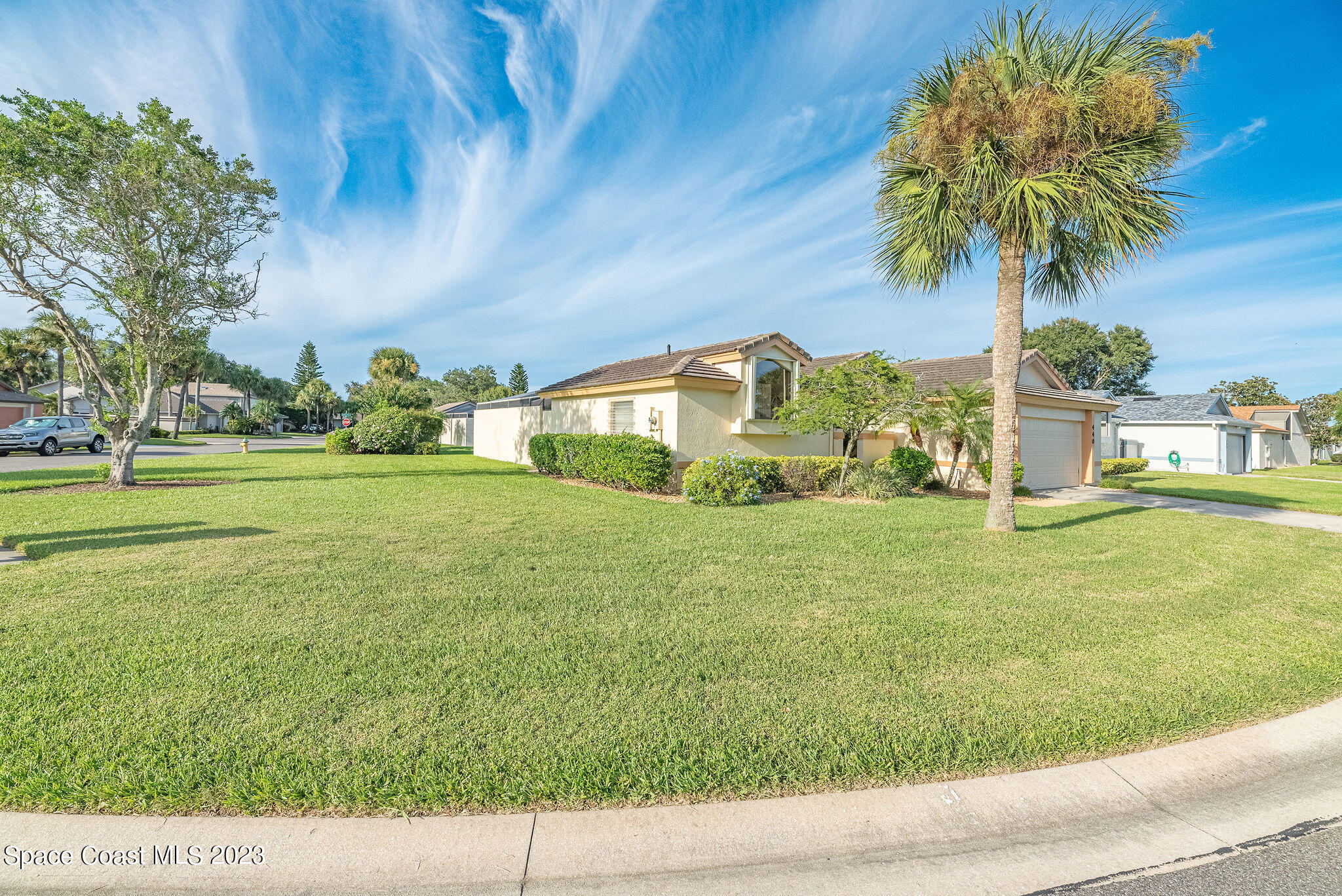 440 Maple Bluff Circle Melbourne, FL 32940 - Photo 86 of 92 a view of a garden with a house